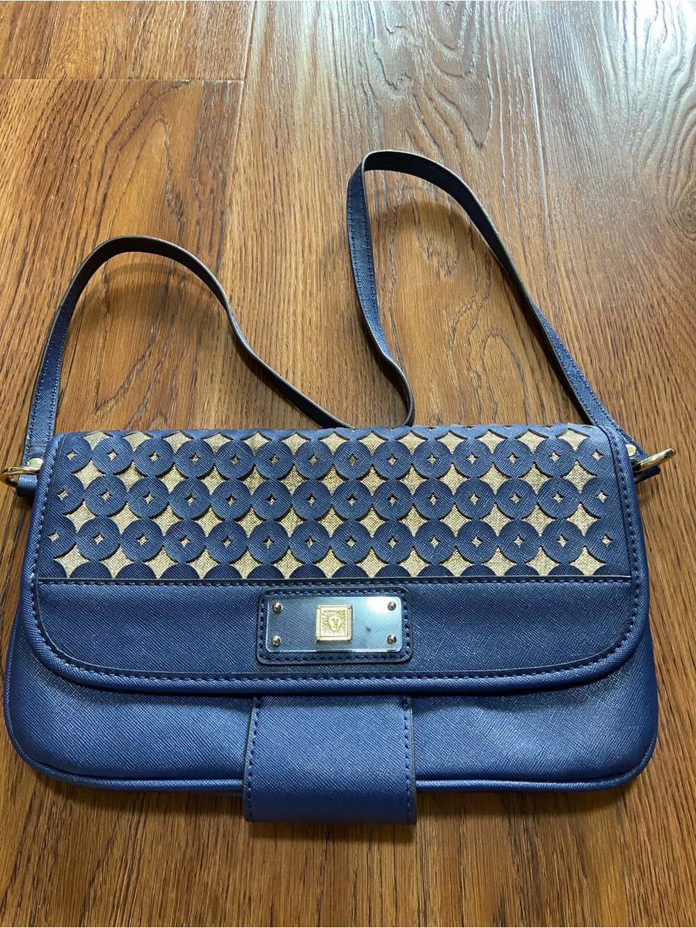 Anne Klein Navy and Gold Perforated Crossbody Bag with floral print inside